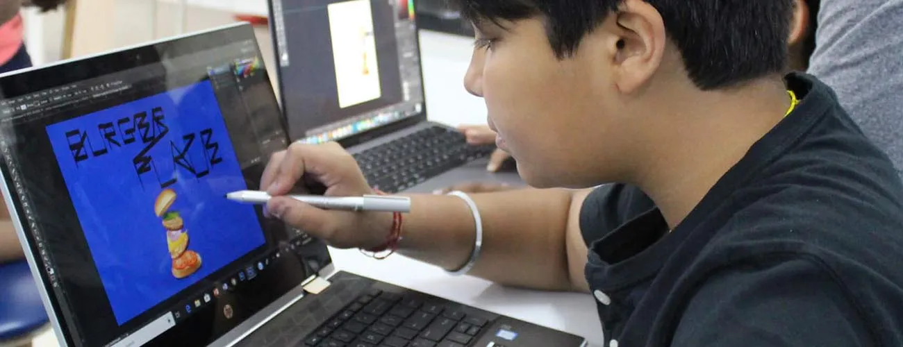 Student in a CodingChamp Video Editing (Premiere Pro) class